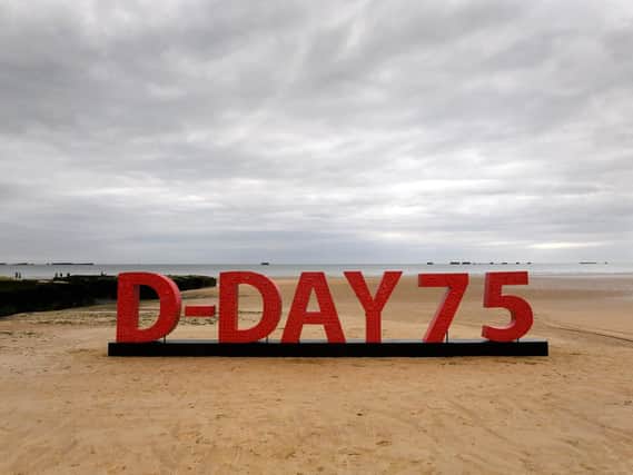 An installation made from 20,000 poppies with messages from supporters of the Royal British Legion goes on display to commemorate the 75th anniversary of the D-Day landings at the beaches of Arromanches in Normandy, France. Picture: Doug Peters/PA Wire