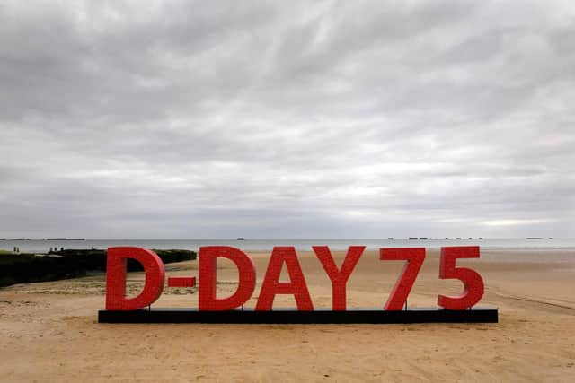 An installation made from 20,000 poppies with messages from supporters of the Royal British Legion goes on display to commemorate the 75th anniversary of the D-Day landings at the beaches of Arromanches in Normandy, France. Picture: Doug Peters/PA Wire
