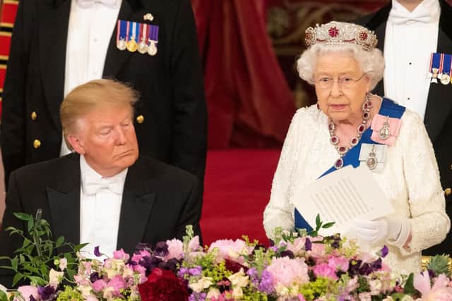 US President Donald Trump listens as Queen Elizabeth II makes a speech during the State Banquet at Buckingham Palace, London, on day one of President Trump's three day state visit to the UK. Picture: Dominic Lipinski/PA Wire