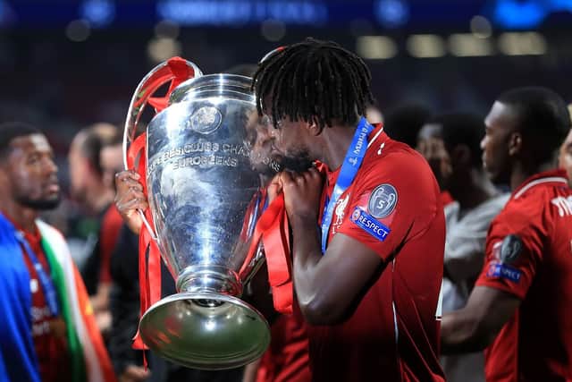 Liverpool's Divock Origi kisses the trophy after the final whistle during the UEFA Champions League Final at the Wanda Metropolitano, Madrid. Picture: Mike Egerton/PA Wire.