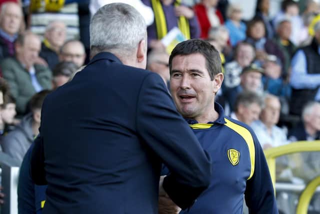 Burton boss Nigel Clough shakes hands with Pompey manager Kenny Jackett. Picture: Daniel Chesterton