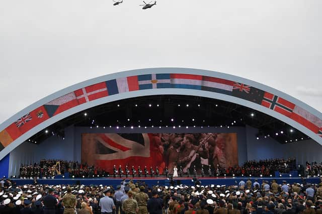 Helicopters fly over the stage as Sheridan Smith sings during the D-Day 75 event on Southsea Common