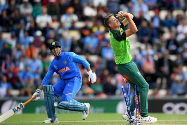 South Africa's Chris Morris collides with the stumps while taking the catch of MS Dhoni, of India, during the group stage match of the ICC Cricket World Cup 2019 between South Africa and India at the Ageas Bowl. Picture: Alex Davidson/Getty Images