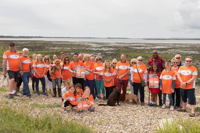 Sue Tinney, centre alongside Havant MP Alan Mak, surrounded by the walkers who took on her 6K Walk for Water on Sunday. Picture: Keith Woodland (090619-12)