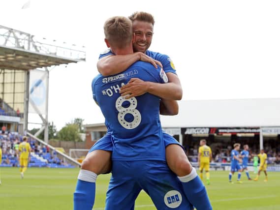 Pompey target Matt Godden (facing camera) celebrates a Peterborough goal against Bristol Rovers. (Picture: Joe Dent/JMP)