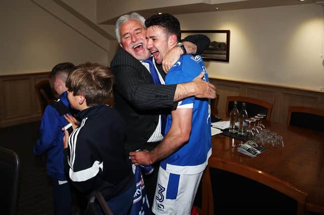 Enda Stevens celebrates the League Two title with Pompey chairman Iain McInnes - now he's in the Premier League. Picture: Joe Pepler
