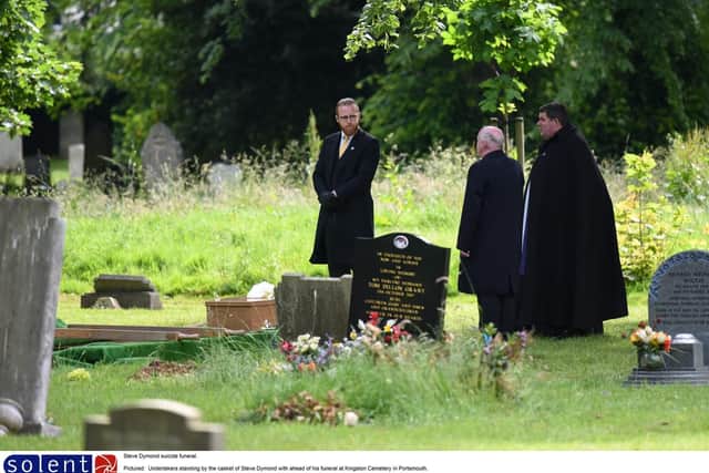 Undertakers standing by the casket of Steve Dymond. Picture:  Jordan Pettitt/Solent News & Photo Agency