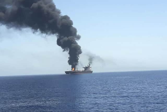 In this photo released by state-run IRIB News Agency, an oil tanker is on fire in the sea of Oman. Picture: (IRIB News Agency via AP)