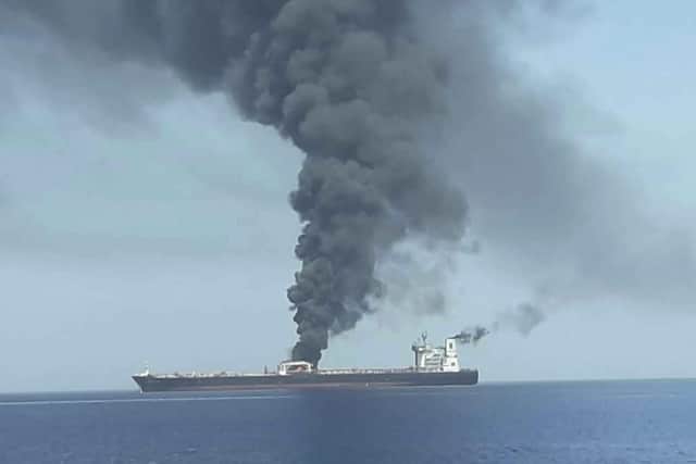 In this photo released by state-run IRIB News Agency, an oil tanker is on fire in the sea of Oman. Picture: (IRIB News Agency via AP)