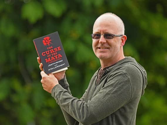 Teacher Jonathan Pearce with his new book The Curse of the Maya
Picture: Malcolm Wells (190611-9583)