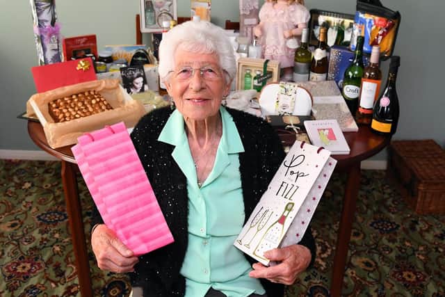 Joyce Taylor at her Purbrook home with some of the prizes that have been donated for her 90th birthday raffle. Picture: Malcolm Wells (190610-2148)