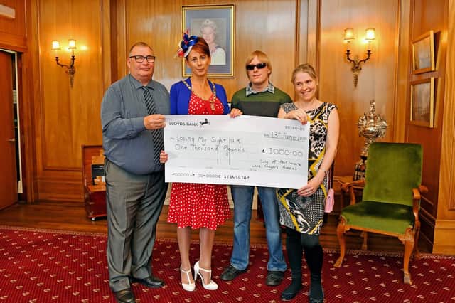The Lady Mayoress of Portsmouth Leza Tremorin presented Losing Our Sight a cheque for 1,000 on behalf of The Lord Mayor from his 'City of Portsmouth Lord Mayor's Appeal Fund'. From left, Losing My Sight founder Dave Taylor, Lady Mayoress Leza Tremorin, David Shervill, and Losing My Sight director Elena Sommers 
Picture: Malcolm Wells (190613-2526)