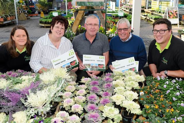 The winner and runners-up in The News, Portsmouth Bloomin' Marvellous competition, collected their gardening vouchers from Garsons garden centre in Titchfield. Pictured from left is:Clare James, director, Bethney Kelly from Gosport, Geoff Craig from Copnor, Ray Hunt from Purbook and Callum Hartley, plantsman. Picture: Sarah Standing (180798-7180)