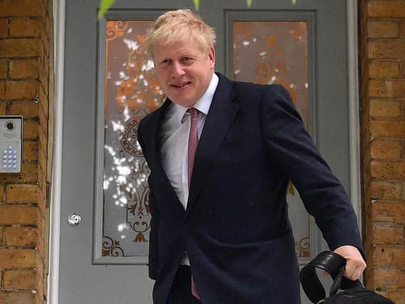 Conservative MP Boris Johnson leaves a house in London on. Photo: Daniel Leal-Olivas/AFP/Getty Images