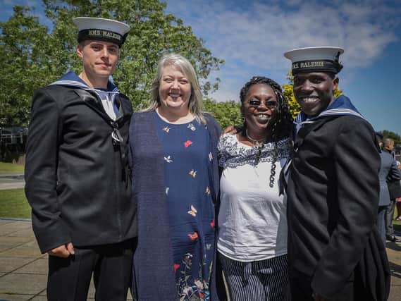 Now-HMS Sultan recruit Cameron Hawes his mum Sarah Hole, Althea Crosby, and her son Quaci Crosby of HMS Raleigh, who was stunned to see his mum at the passing-out parade. Picture: Mark Johnson/Royal Navy