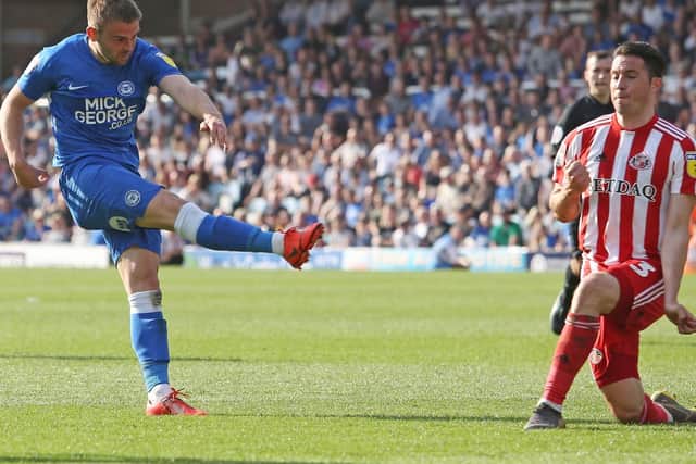 Peterborough have told Pompey to up their bid for Matt Godden (left). Picture: Joe Dent