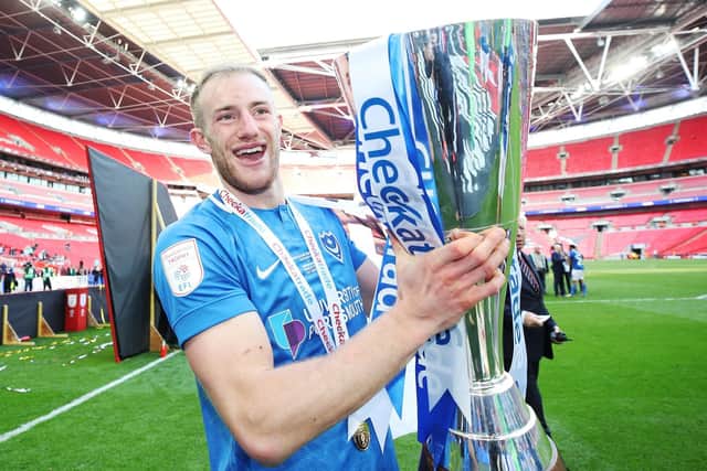 Matt Clarke celebrates with the Checkatrade Trophy. Picture: Joe Pepler