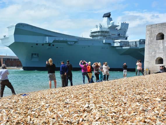 HMS Queen Elizabeth as she sailed out of Portsmouth. Picture: Ben Mitchell/PA Wire