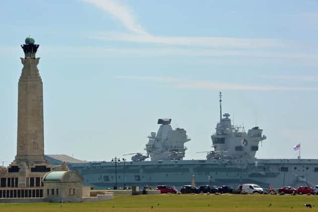 Royal Navy aircraft carrier HMS Queen Elizabeth sails past the Portsmouth Naval Memorial on Southsea Common, after sailing out of Portsmouth Harbour for sea trials. Picture: Ben Mitchell/PA Wire