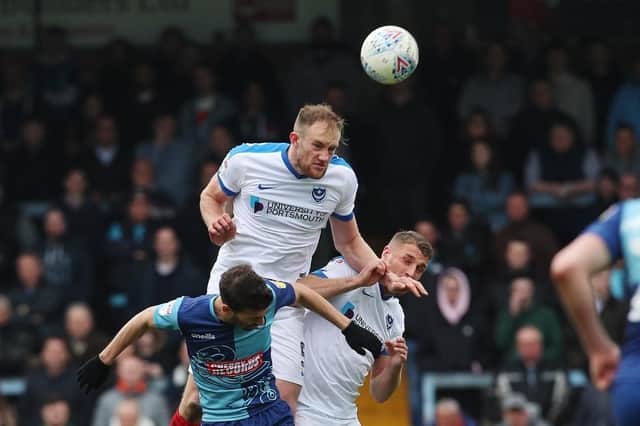 Matt Clarke powers in a header against Wycombe in April's 3-2 Pompey success. Picture: Joe Pepler