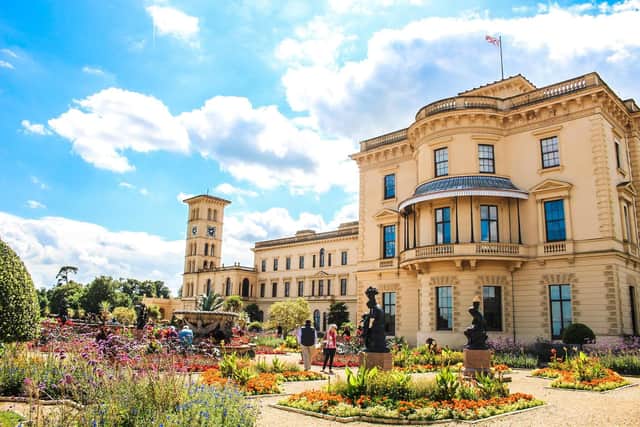 BURNISHED: Osborne House glows orange in the summer sunrise across the Solent