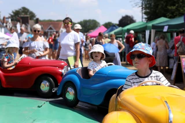 Children enjoy the rides at the 2018 Rowlands Castle Village Fair on The Green. Picture: Chris Moorhouse