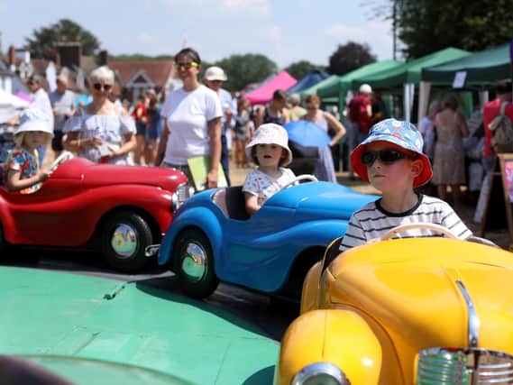 Children enjoy the rides at the 2018 Rowlands Castle Village Fair on The Green. Picture: Chris Moorhouse