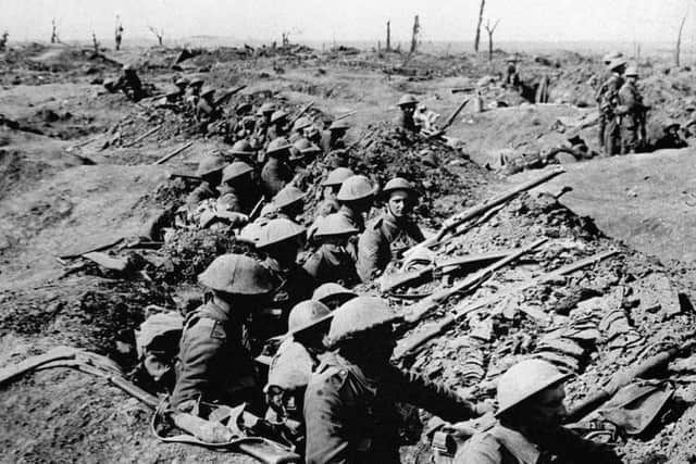 British infantrymen occupying a shallow trench before an advance during the Battle of the Somme. Picture: PA