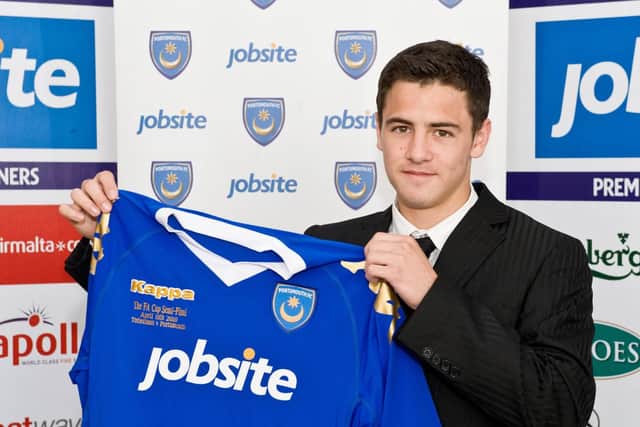 Ryan Williams poses with a Pompey shirt after becoming a first-year scholar in July 2010. Picture: Robin Jones