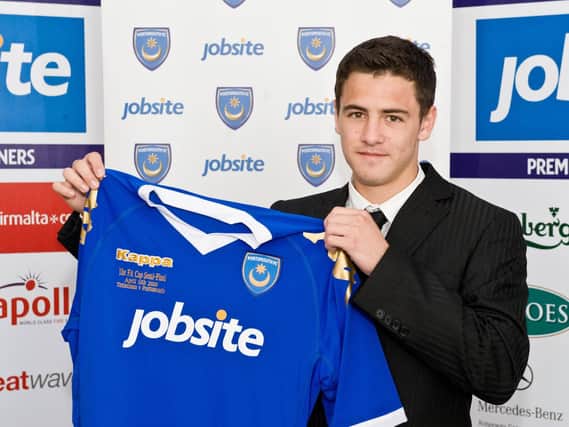 Ryan Williams poses with a Pompey shirt after becoming a first-year scholar in July 2010. Picture: Robin Jones