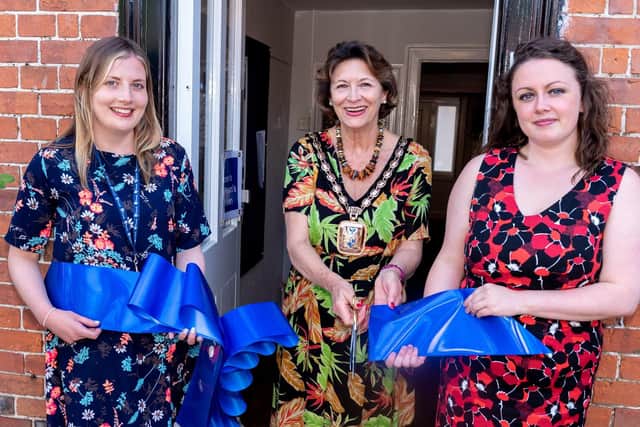 Mayor of Havant Diana Patrick cuts the ribbon held by Danielle Barnes and Maria Morrell. Picture: Vernon Nash (290619-002)