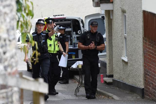 Police at the scene of the murder in Hambledon. Picture: Solent News & Photo Agency