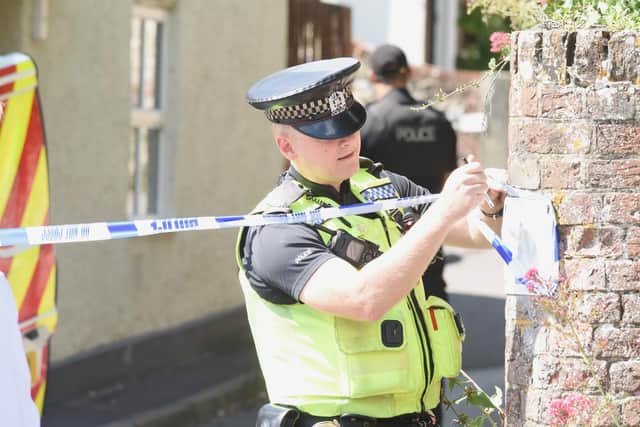 Police at the scene of the murder in Hambledon. Picture: Solent News & Photo Agency