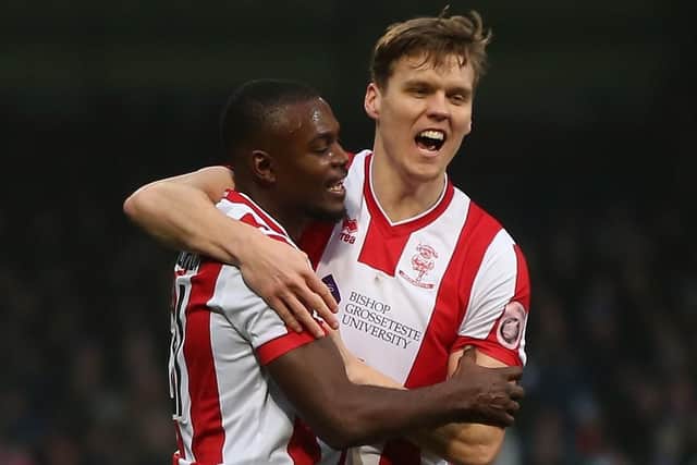 Sean Raggett. right, showed a Premier League attitude during his Lincoln days. Picture: Alex Morton/Getty Images