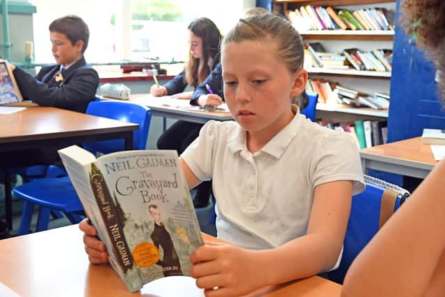 Fran Osborne, 11, will be joining Portchester Community School from Castle Primary School - Fran enjoys reading and recently has been reading a book by Clare Balding 
Picture: Malcolm Wells (190703-3488)