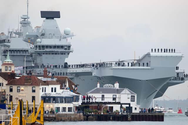 HMS Queen Elizabeth arriving at Portsmouth Harbour earlier this year. Picture: Steve Parsons/PA Wire
