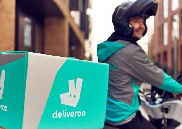 A Deliveroo rider.