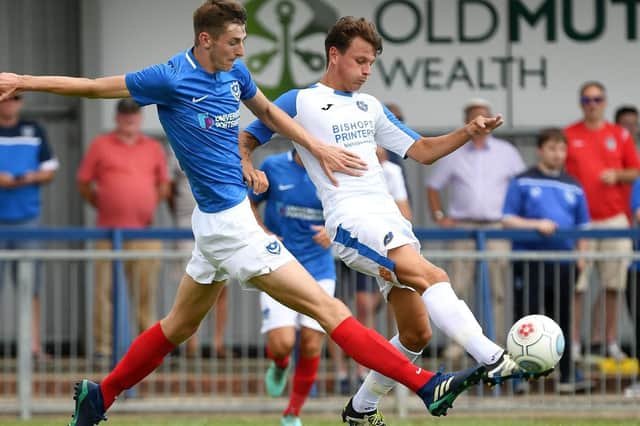 Matt Casey in action for Pompey against the Hawks' Alfie Rutherford. Picture: Neil Marshall
