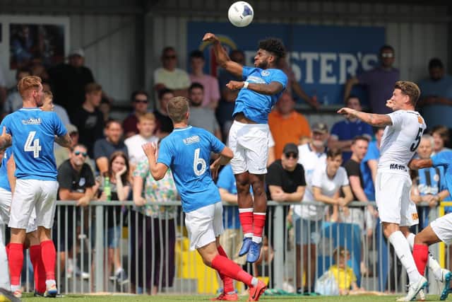 Ellis Harrison challenges for a header in Saturday's 2-1 victory over the Hawks. Picture: Dave Haines