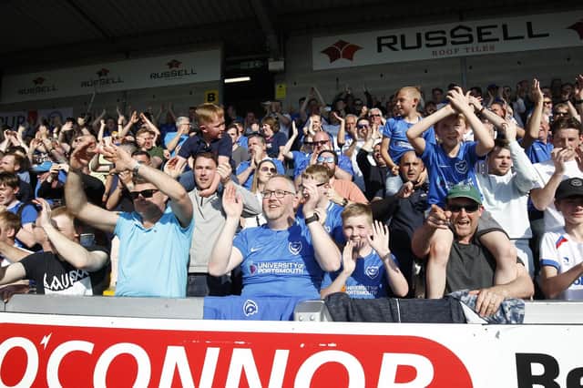 Pompey fans celebrate victory at Burton in April. Picture: Daniel Chesterton/phcimages.com