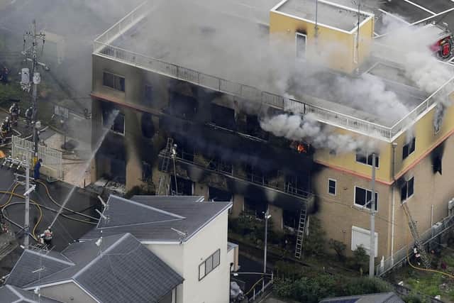 Smoke billows from a three-story building of Kyoto Animation in a fire in Kyoto, western Japan, Thursday, July 18, 2019. Kyoto prefectural police said the fire broke out Thursday morning after a man burst into it and spread unidentified liquid and put fire. Picture: Kyodo News via AP