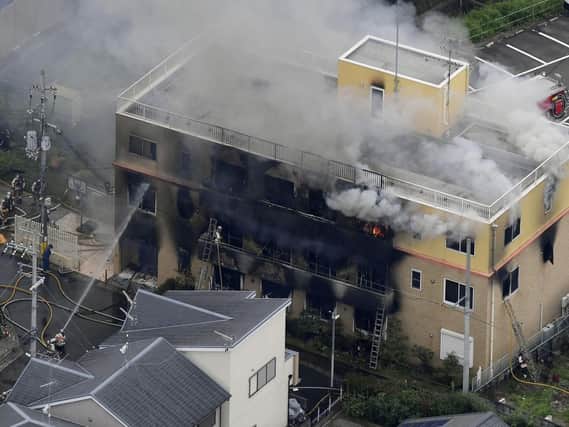 Smoke billows from a three-story building of Kyoto Animation in a fire in Kyoto, western Japan, Thursday, July 18, 2019. Kyoto prefectural police said the fire broke out Thursday morning after a man burst into it and spread unidentified liquid and put fire. Picture: Kyodo News via AP