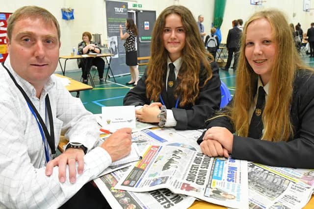 The News' education reporter, Neil Fatkin, with Luisa Marthinsen, 15, and Molly Cooper, also 15. Picture: Malcolm Wells (190717-4077)