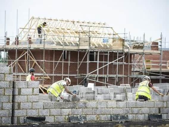 File photo of builders on a building site. Picture: Ben Birchall/PA Wire