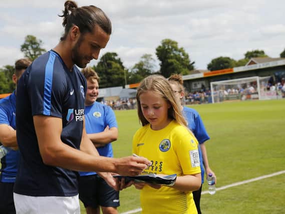 Christian Burgess signs autographs ahead of Pompey's 2-1 friendly victory over the Hawks. Picture: Dave Haines/Portsmouth News