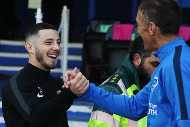 Conor Chaplin with Pompey goalkeeping coach John Keeley during Coventry's visit to Fratton Park last season. Picture: Joe Pepler