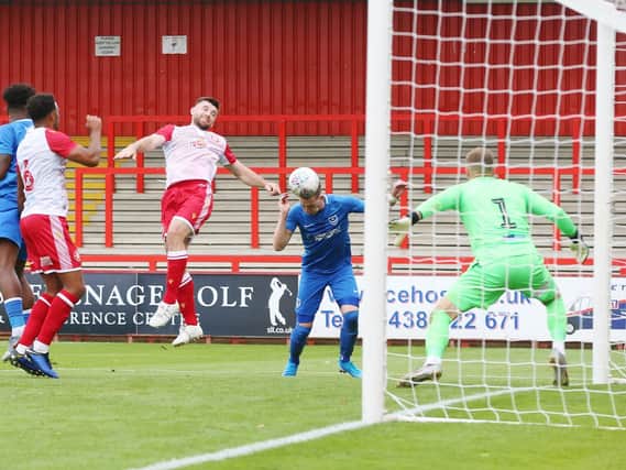 Ronan Curtis heads home Jamal Lowe's cross to earn Pompey a 1-0 victory at Stevenage. Picture: Joe Pepler
