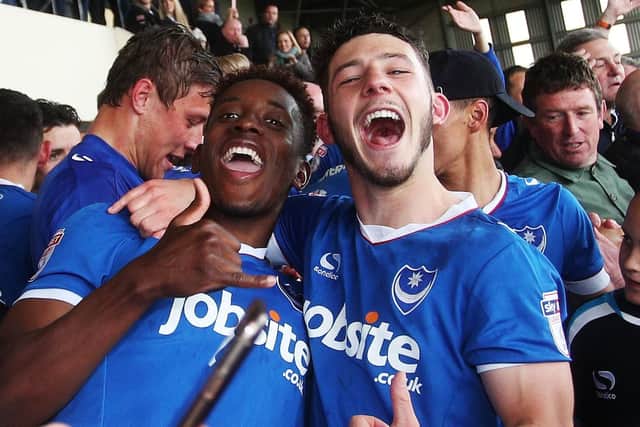 Jamal Lowe, left, and Conor Chaplin celebrate Pompey's promotion from League Two at Notts County. Picture: Joe Pepler