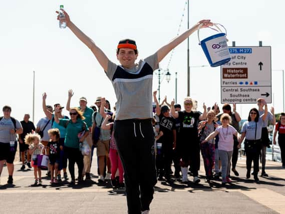 Harley Salter approaches South Parade Pier with his family and friends supporting behind. Picture: Vernon Nash (200719-002)