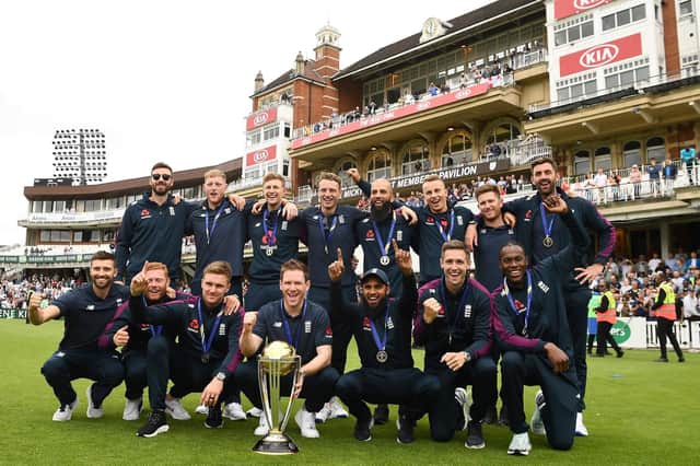 England celebrate their World Cup win with James Vince, back left, and Liam Dawson, back row, second right. Picture: AFP/Getty Images
